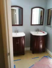 Installing new vanities and mirrors